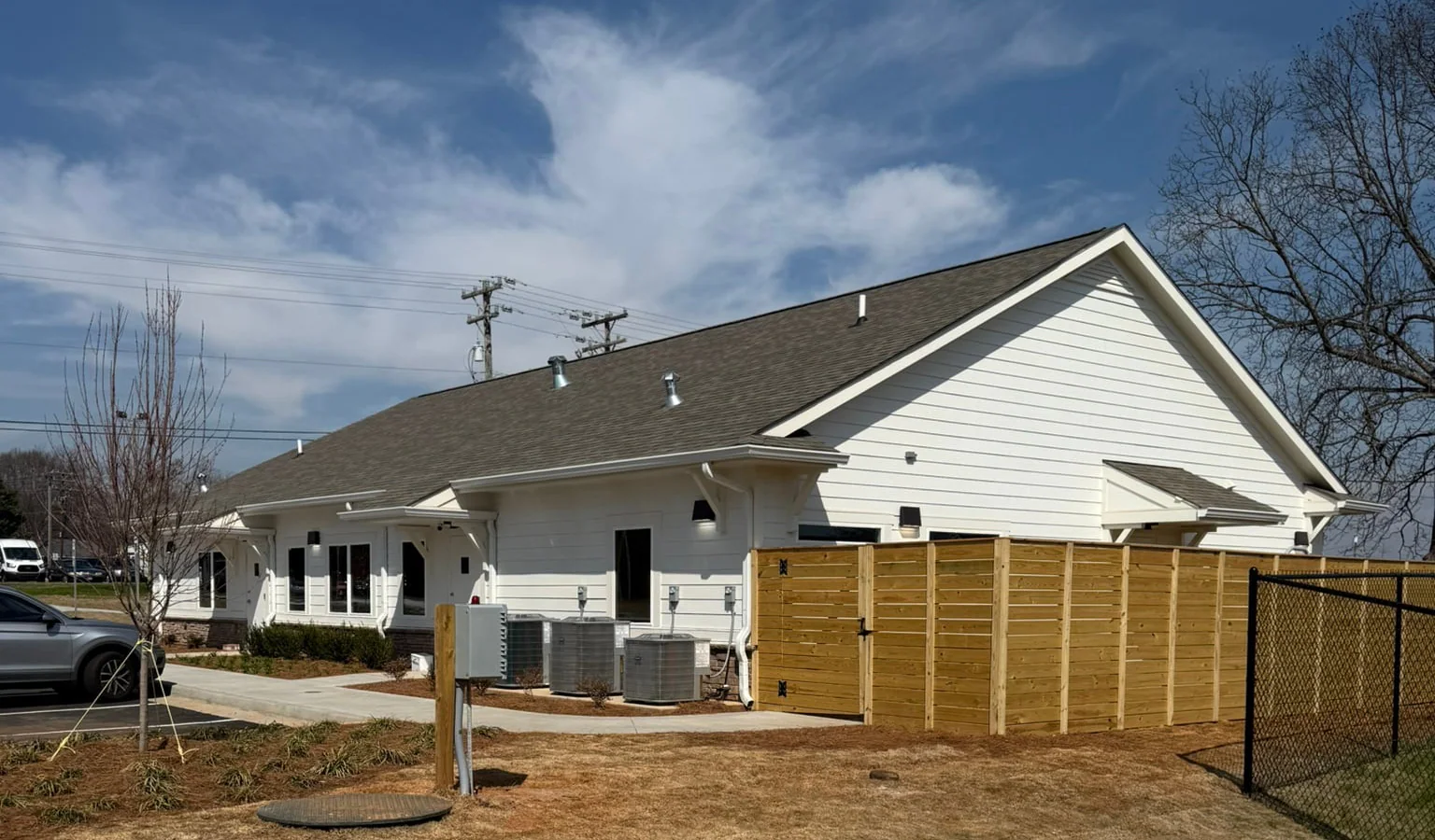 Completed shingle roof on a commercial facility, wide exterior view
